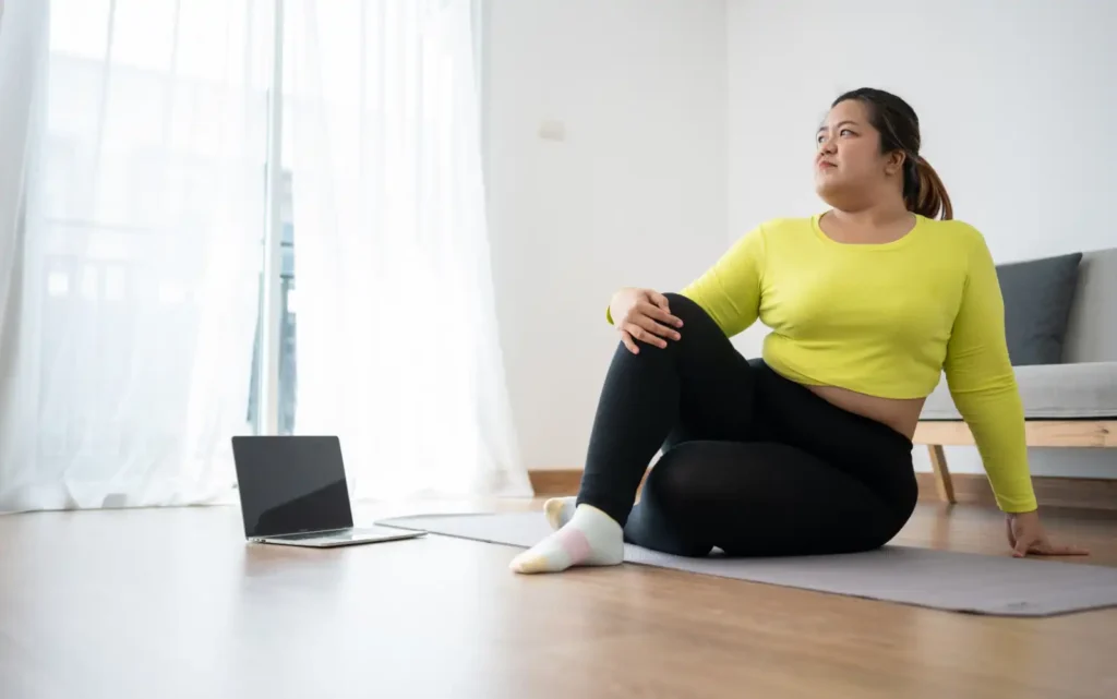 Woman on Yoga Mat with Laptop