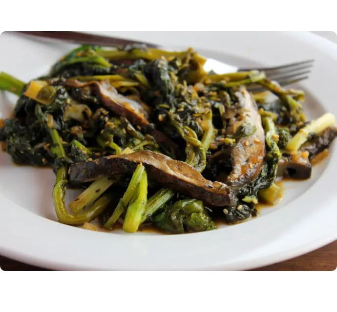 Sesame Broccoli Rabe on a plate with a fork