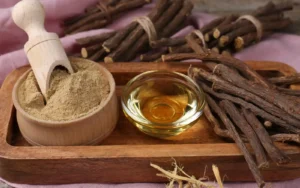 Dried Licorice root on a wooden tray.