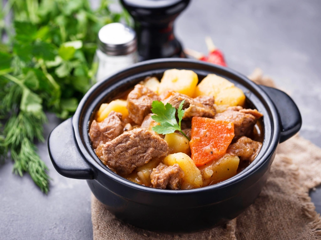 Beef stew with potatoes and carrots served on a ramekin