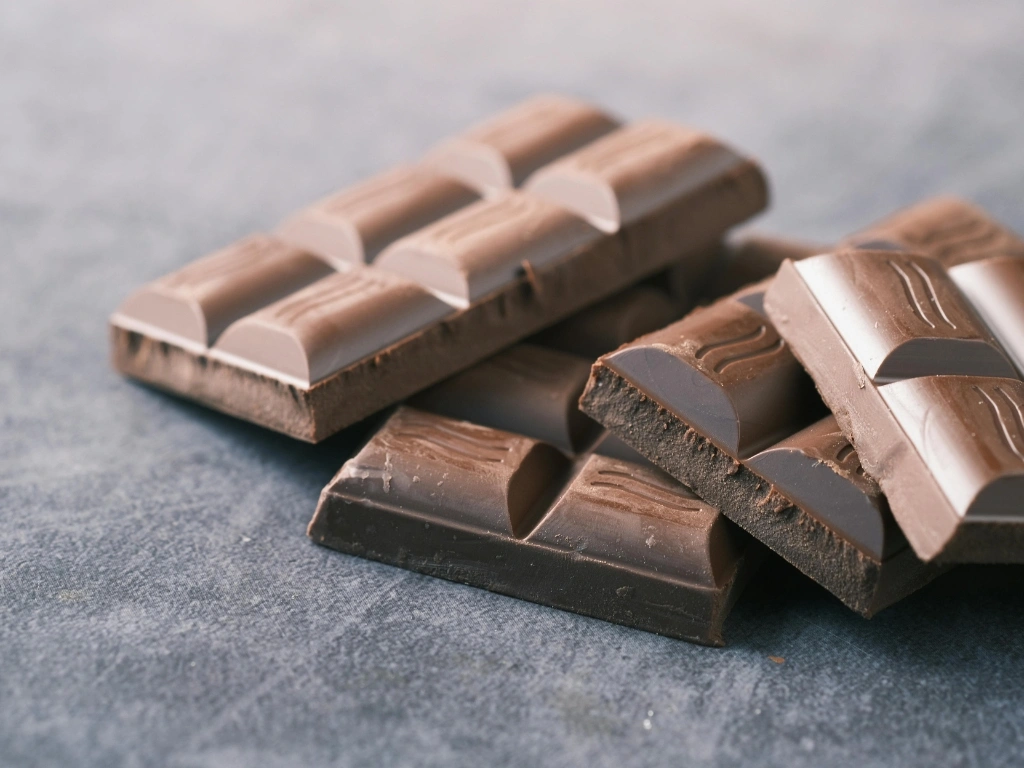 Four chocolate bars stacked on top of one another