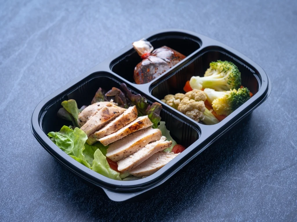 healthy food delivery for take away boxes for daily nutrition on blue background