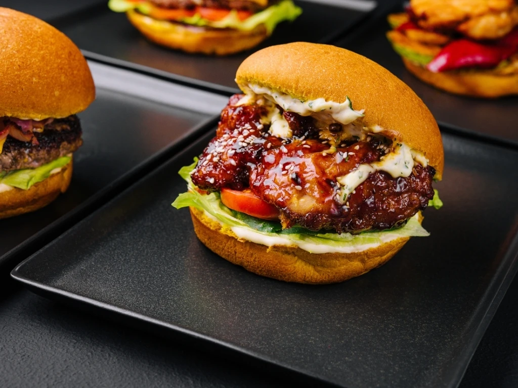 Turkey black bean burgers served on black plates