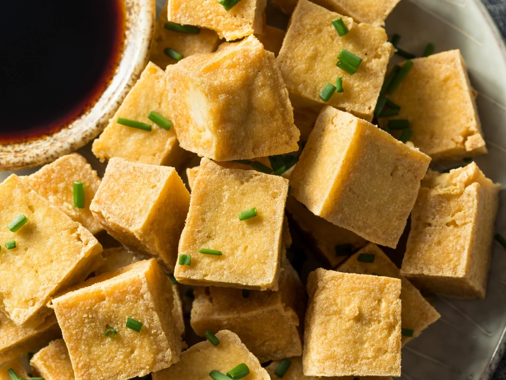 Crispy tofu cubes served with soy sauce dip