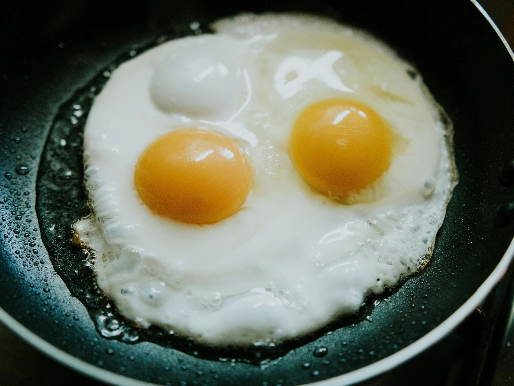 Two eggs fried in a pan