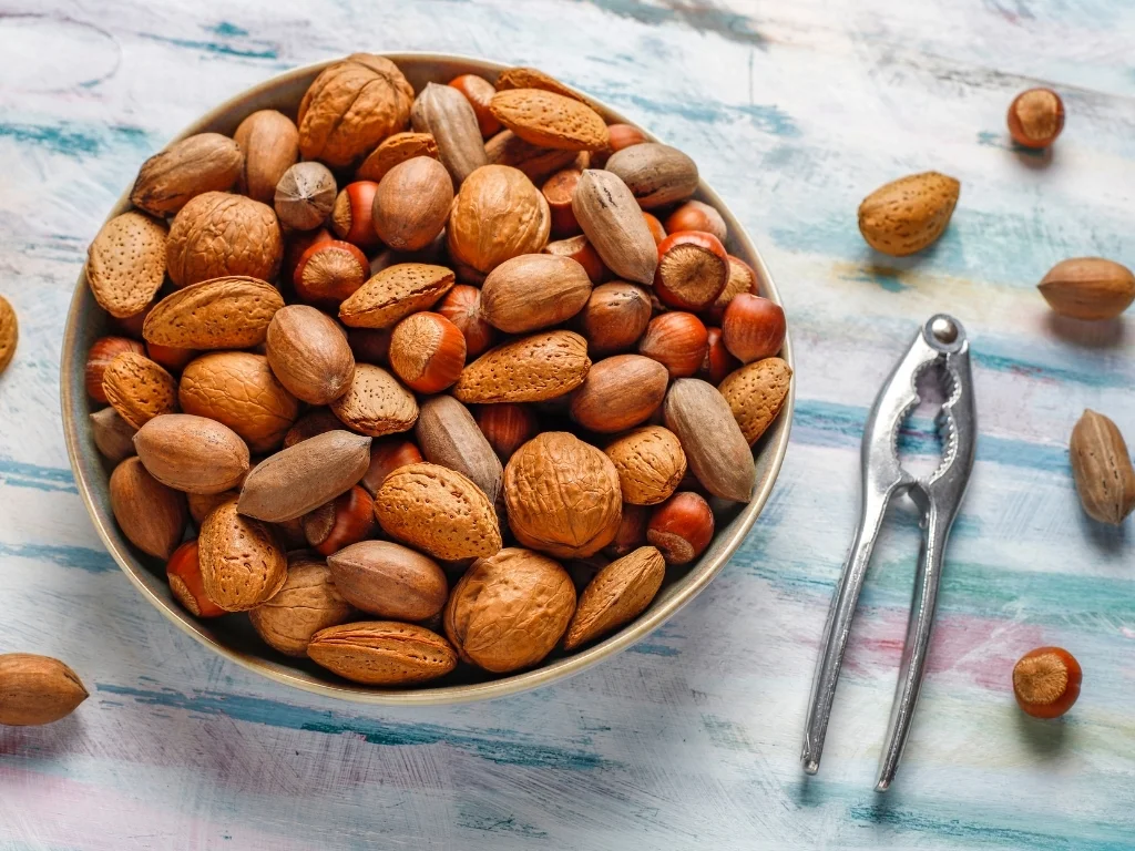 Mixed organic nuts on a colorful surface