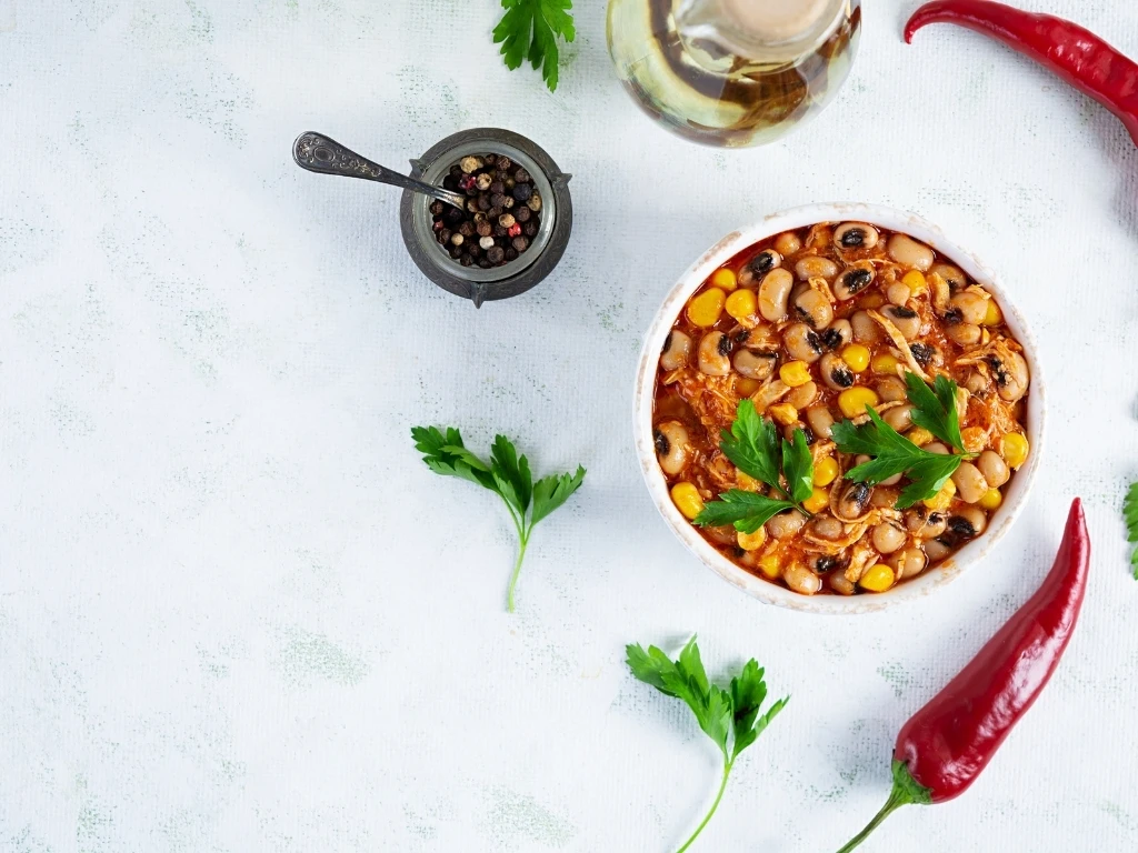 Chili con carne in a bowl. Mexican cuisine. Chili with meat, corn and beans