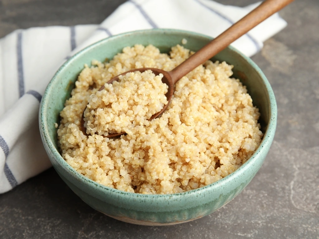 4. Couscous and bulgur Bulgur is a whole-grain cracked wheat that’s high in fiber and has a chewy texture, while couscous is a processed, refined pasta made from semolina flour. These two ingredients usually appear in many salads, grain bowls, and Mediterranean dishes. While they may look like grains, they’re actually made from wheat, which means they’re high in gluten. What to eat instead: quinoa or rice Bowl of cooked couscous served with a wooden spoon