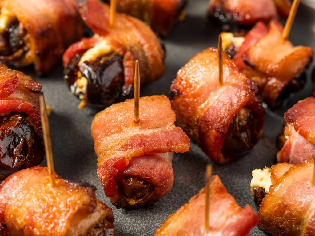 Pork-wrapped dates stuffed with cheese