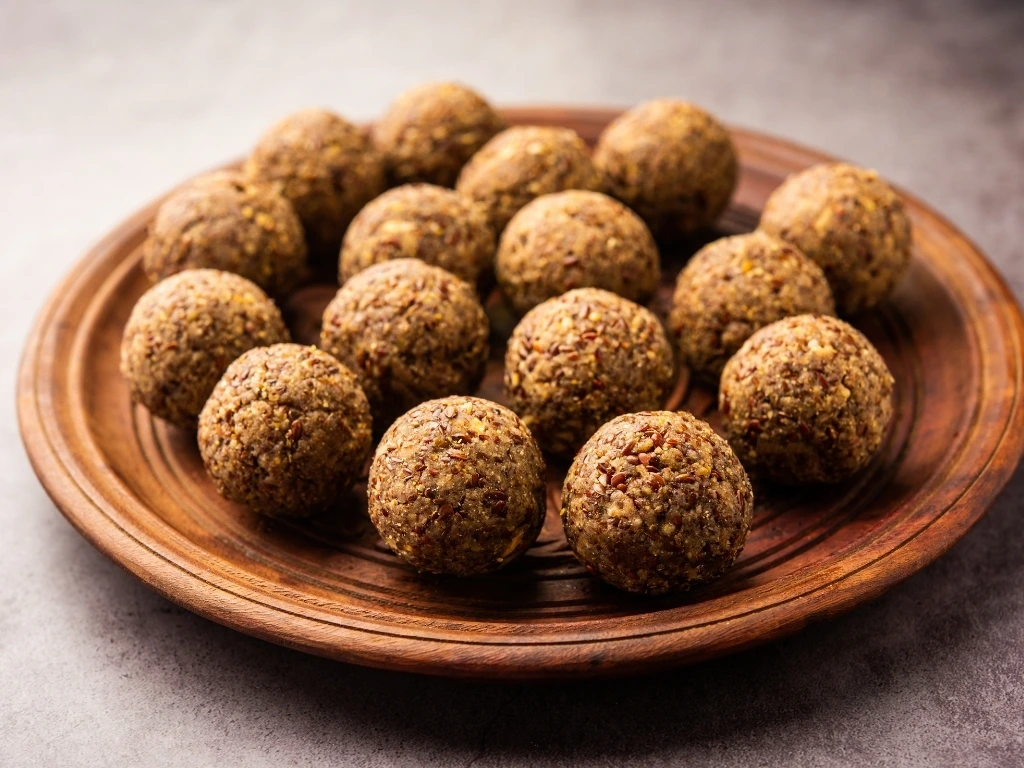 Brown energy balls served on a plate