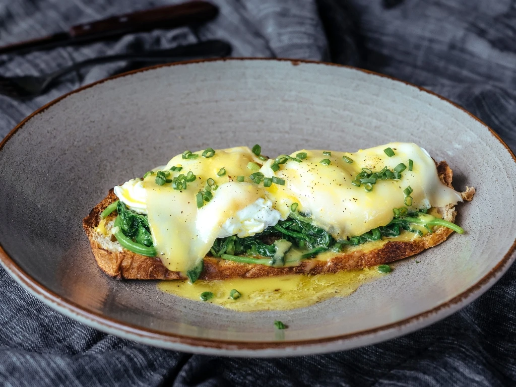 Eggs Florentine on a grey plate