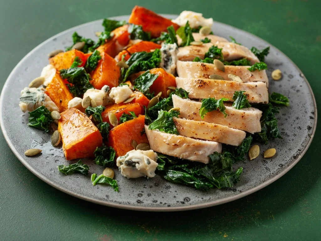 Baked chicken, roasted sweet potato, and spinach salad