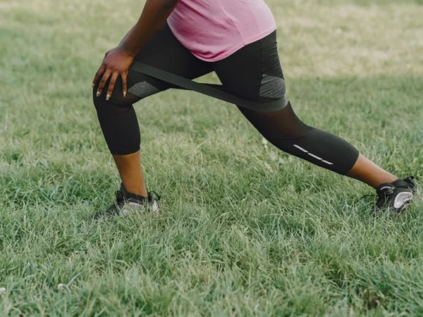 Woman working out in a grass field