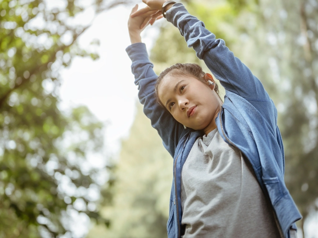 Woman stretching her arms upward
