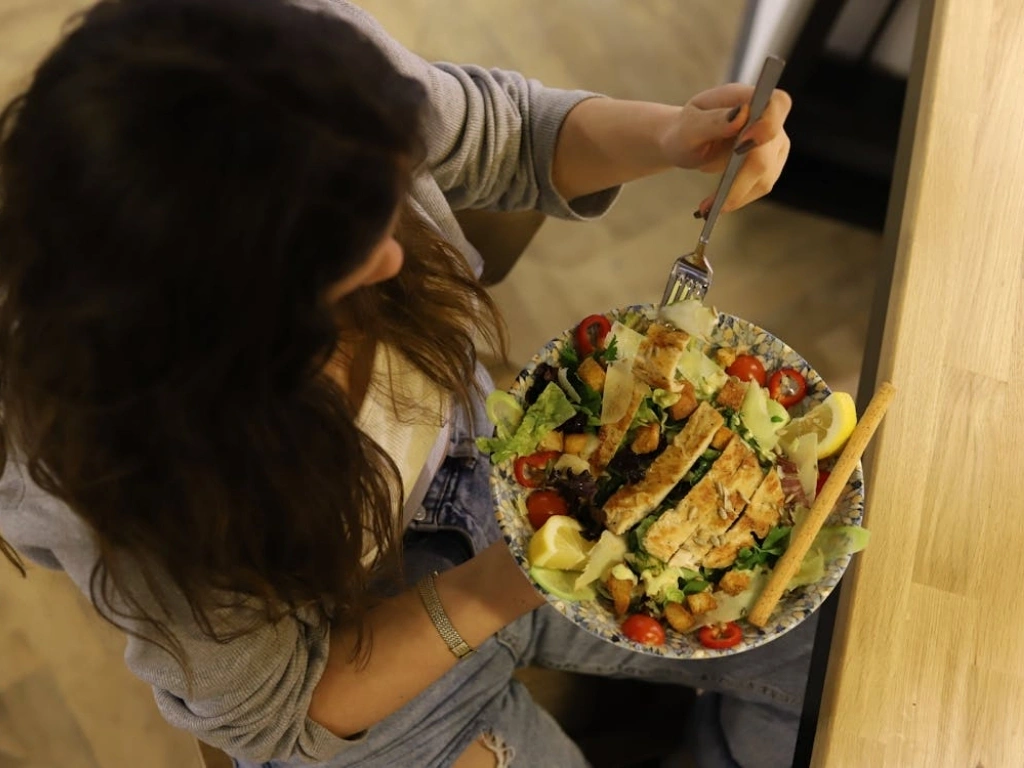 Overhead shot of a woman eating healthy food