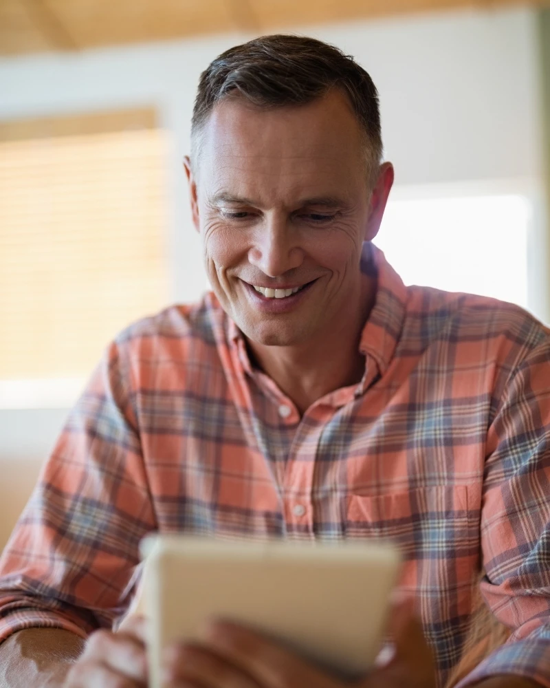 Man using digital tablet in restuarant