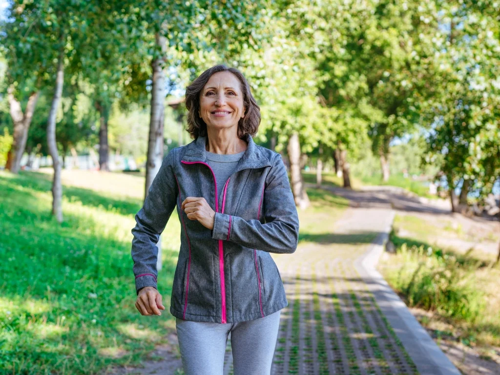 Middle-aged woman jogging in a park