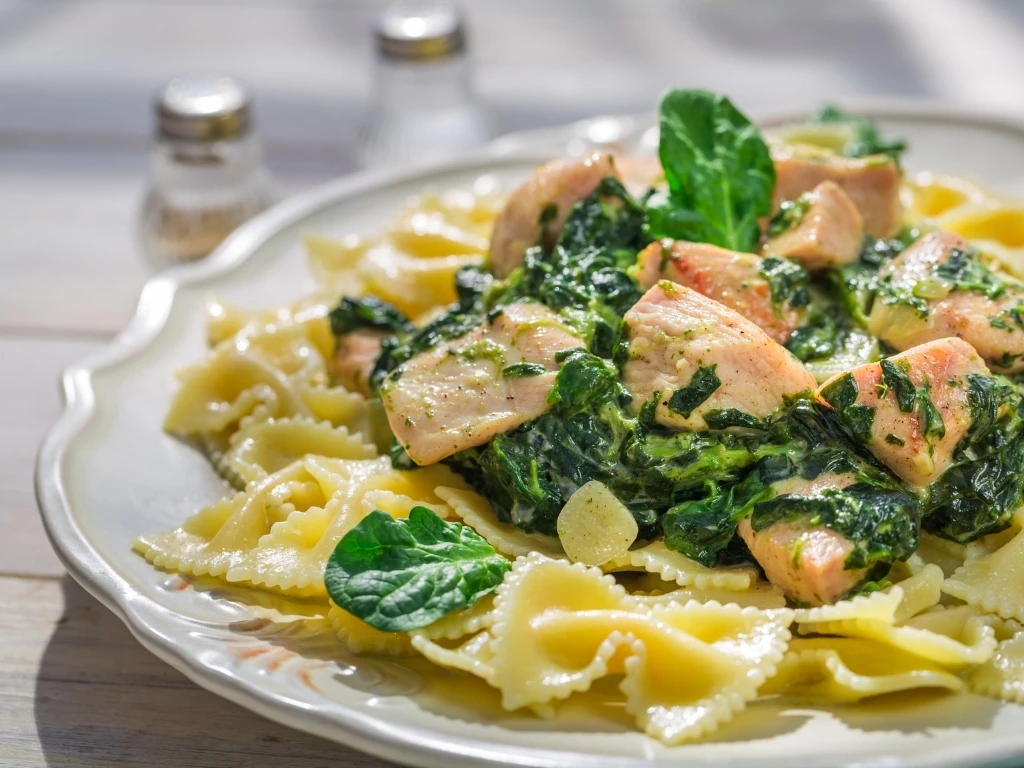 Pasta with chicken and wilted spinach