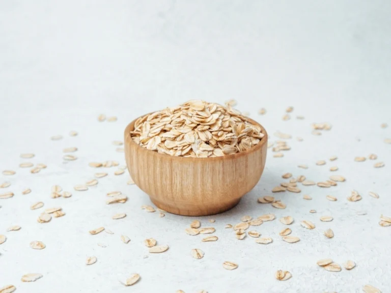 Uncooked oats in a wooden bowl