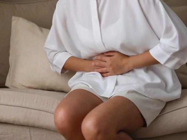Woman holding her stomach in pain