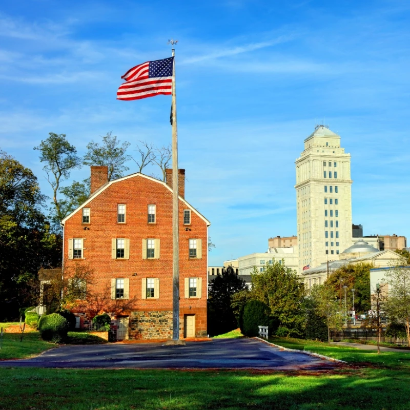 Elizabeth Public Library in Elizabeth, New Jersey, with the Union County Courthouse tower in the background.