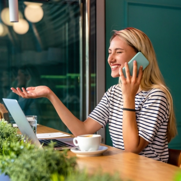 happy woman smiling and using mobile phone. People technology social network concept