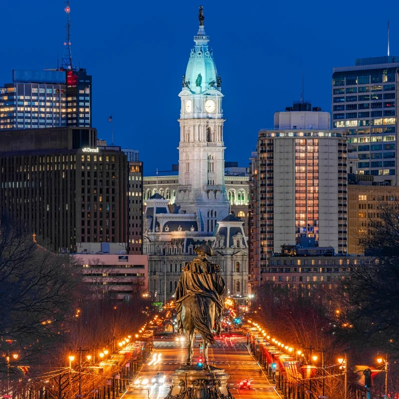 George Washington statue and street in Philadelphia over the city hall with cityscape