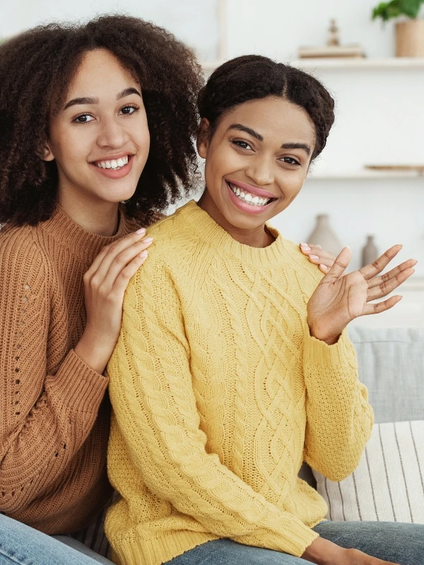 Two females show of happiness, positive and visit friends